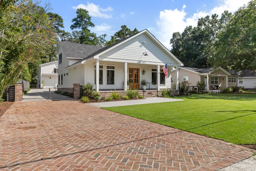Front exterior of a new home in , Charleston, SC, highlighting curb appeal (Image 1).
