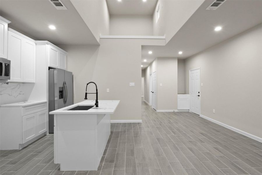 Breasfast area looking up into the loft flex space Breasfast area looking up into the loft flex space