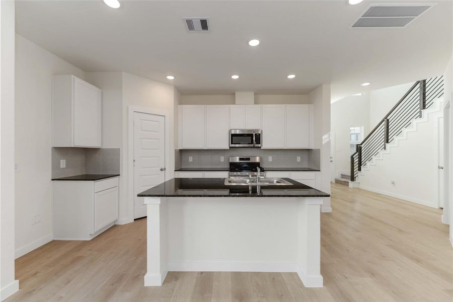 Furnished interior view inside a new home in Granger Pines, Conroe (Image 5).
