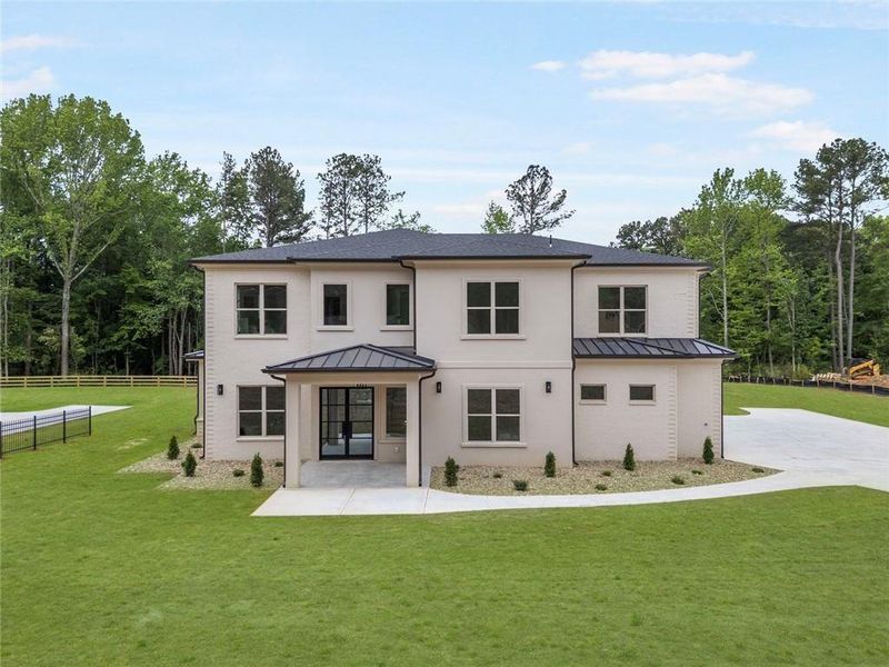 Front exterior of a new home in , Lawrenceville, GA, highlighting curb appeal (Image 1). Front exterior of a new home in , Lawrenceville, GA, highlighting curb appeal (Image 1).