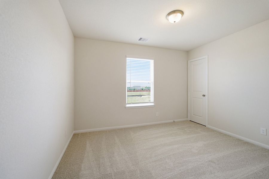 Spacious, unfurnished interior of a new home in Wildrye, Waller (Image 48).