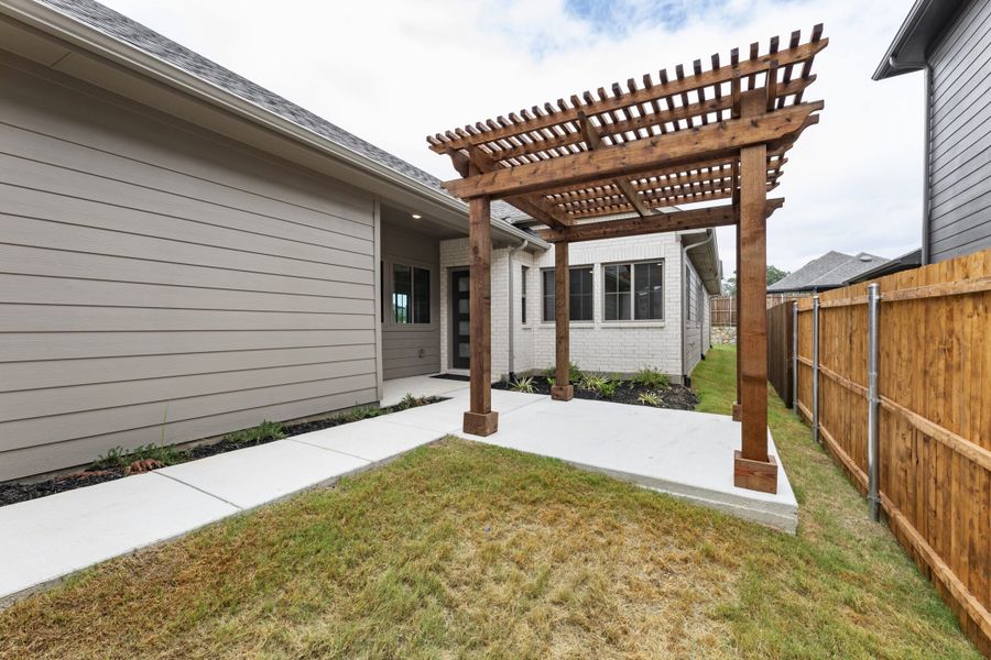 Exterior details and patio area of a home in Keeneland, Aubrey (Image 3).