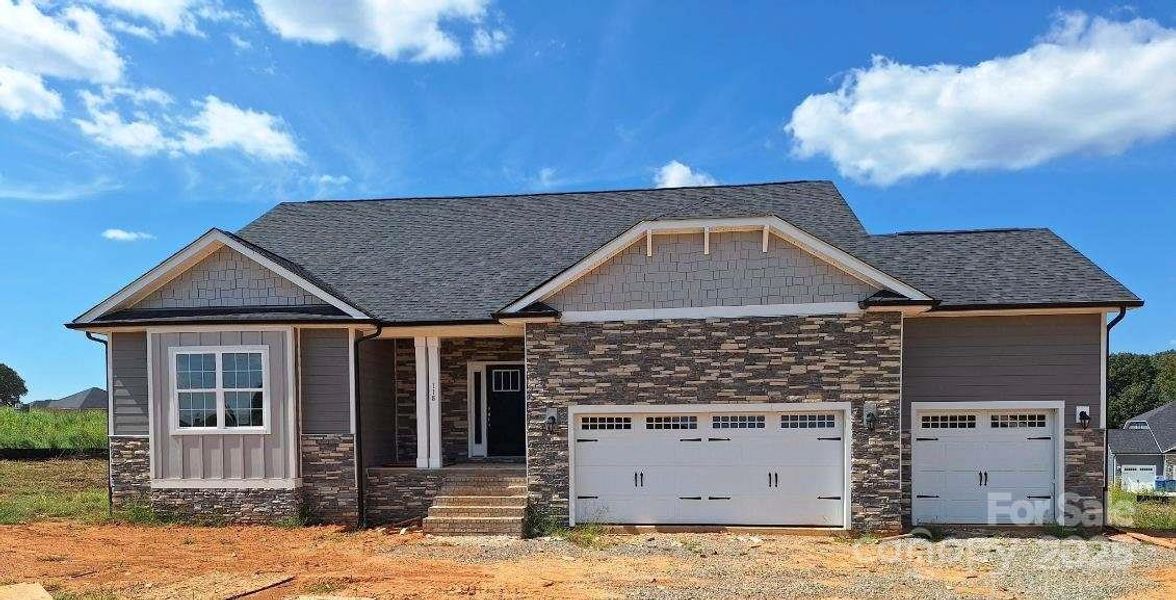 Front exterior of a new home in Swann Hills, Statesville, NC, highlighting curb appeal (Image 1).