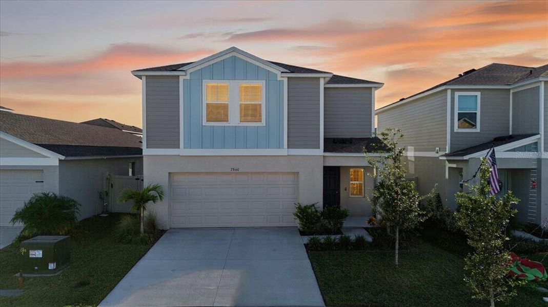 Front exterior of a new home in Pasadena Point, Wesley Chapel, FL, highlighting curb appeal (Image 2). Front exterior of a new home in Pasadena Point, Wesley Chapel, FL, highlighting curb appeal (Image 2).