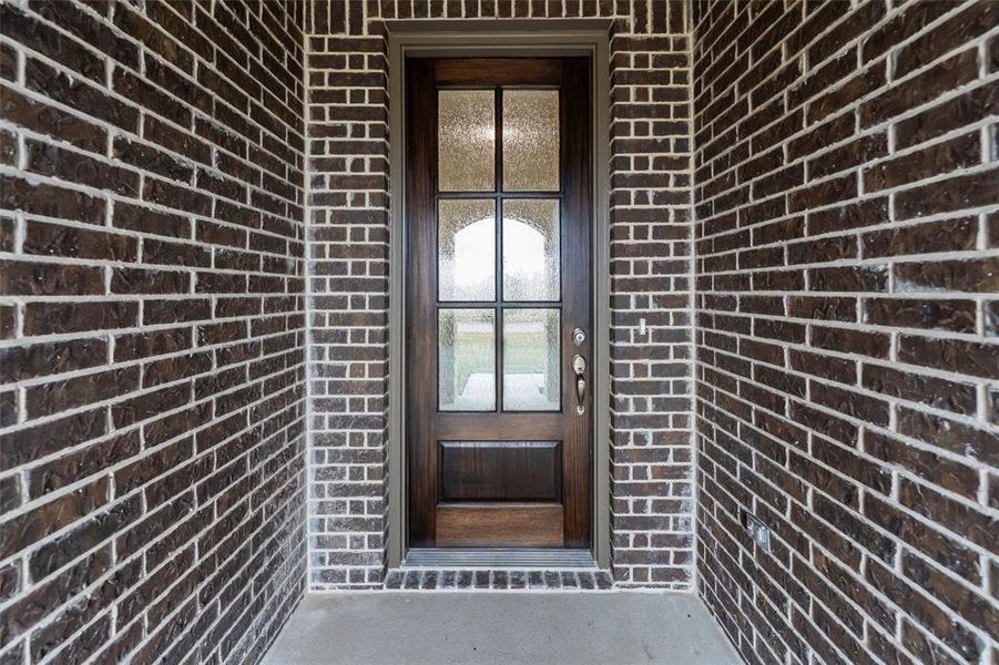 View of exterior entry featuring brick siding View of exterior entry featuring brick siding
