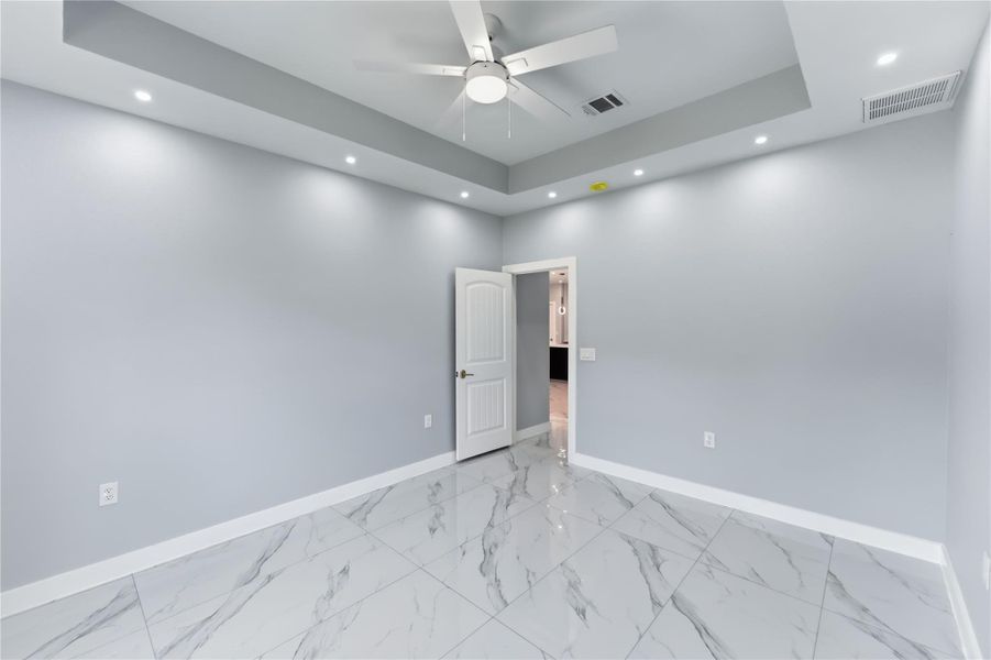 Another view of primary bedroom