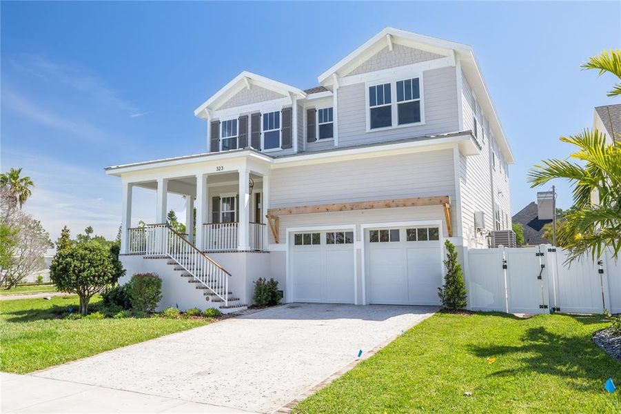 Front exterior of a new home in , St. Petersburg, FL, highlighting curb appeal (Image 1).