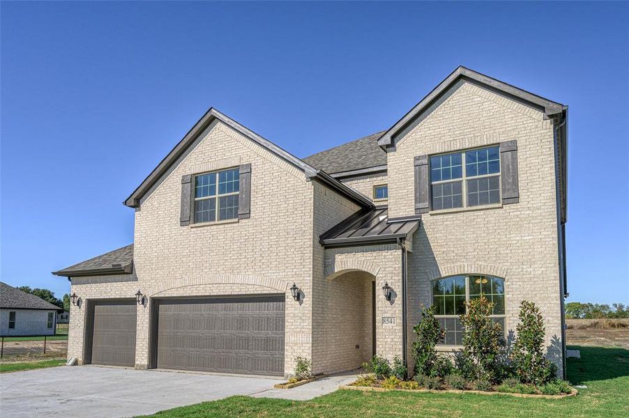 Front exterior of a new home in Pioneer Estates, Blue Ridge, TX, highlighting curb appeal (Image 1). Front exterior of a new home in Pioneer Estates, Blue Ridge, TX, highlighting curb appeal (Image 1).