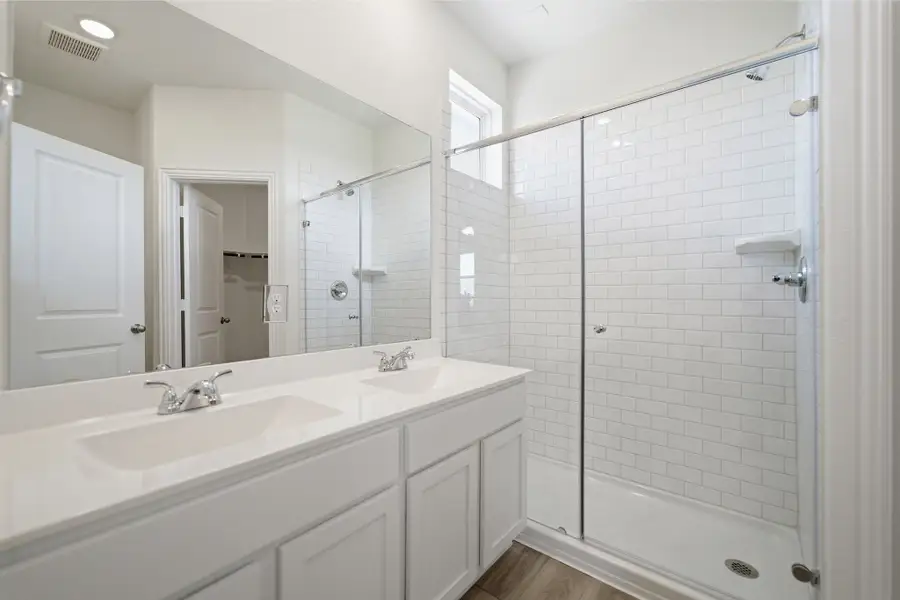 Representative furnished interior of a home built from the Kahn by CastleRock Communities in Municipal Drive Townhomes, Leander (Image 22).