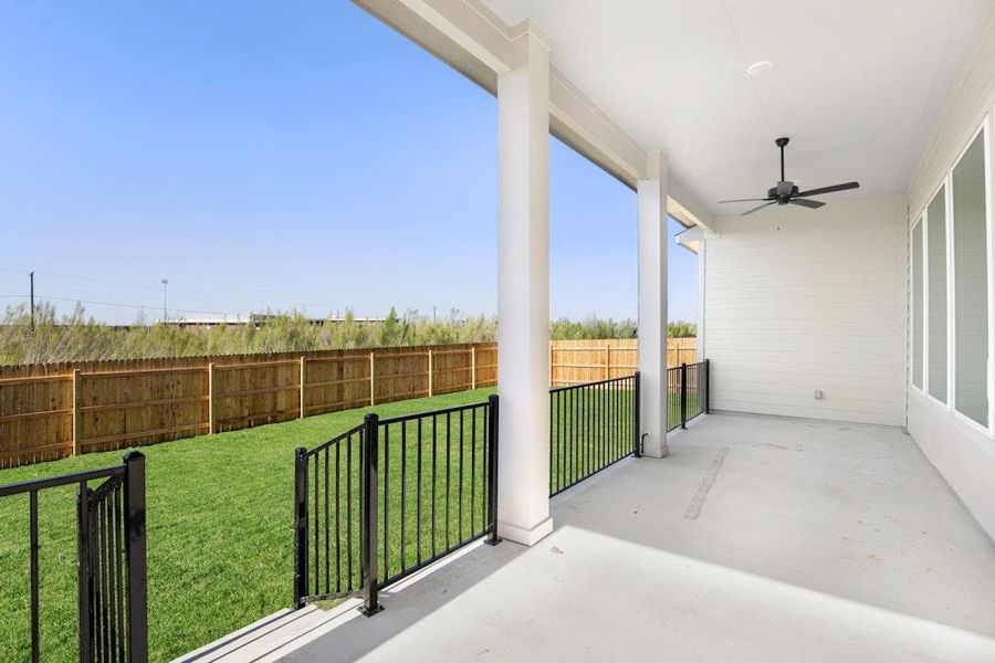 Fenced backyard with a ceiling fan and a patio Fenced backyard with a ceiling fan and a patio