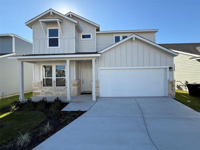 Front exterior of a new home in Wellspring, Round Rock, TX, highlighting curb appeal (Image 1). Front exterior of a new home in Wellspring, Round Rock, TX, highlighting curb appeal (Image 1).