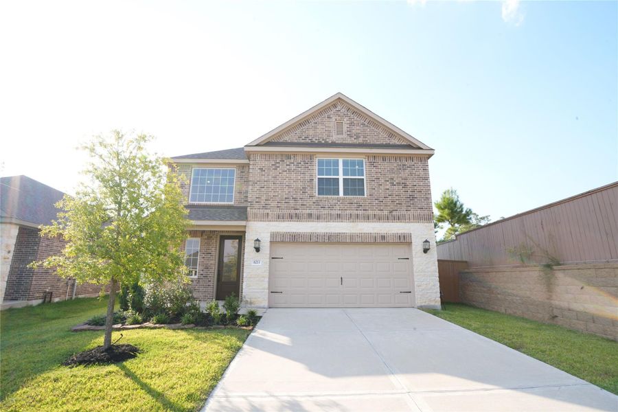 Front exterior of a new home in Wedgewood Forest, Conroe, TX, highlighting curb appeal (Image 1). Front exterior of a new home in Wedgewood Forest, Conroe, TX, highlighting curb appeal (Image 1).