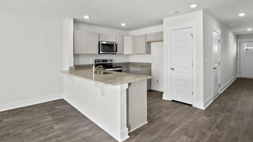 Furnished interior view inside a new home in The Townes at Cedar Hill Landing, Navassa (Image 7).