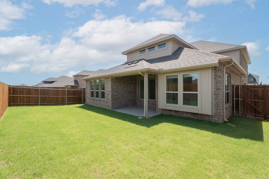 Exterior details and patio area of a home in Valencia on the Lake, Little Elm (Image 2).
