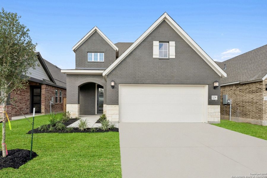 Front exterior of a new home in , New Braunfels, TX, highlighting curb appeal (Image 1). Front exterior of a new home in , New Braunfels, TX, highlighting curb appeal (Image 1).