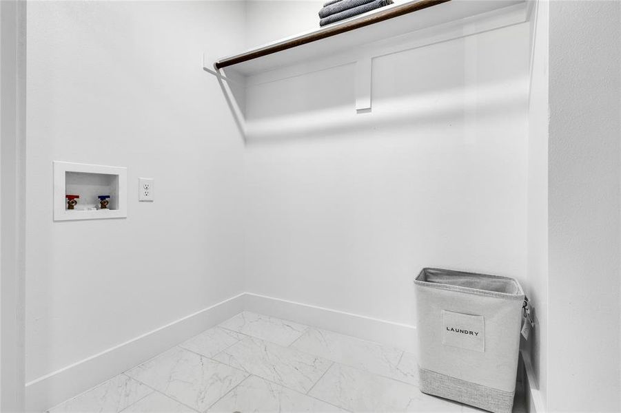 Laundry area with tile floors and hookup for a washing machine