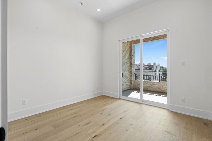 Fourth floor bedroom - Your view from the dining room to the living room with access to your balcony. -  Come tour our furnished model home open Saturday & SundayEstimated completion November 30, 2025.