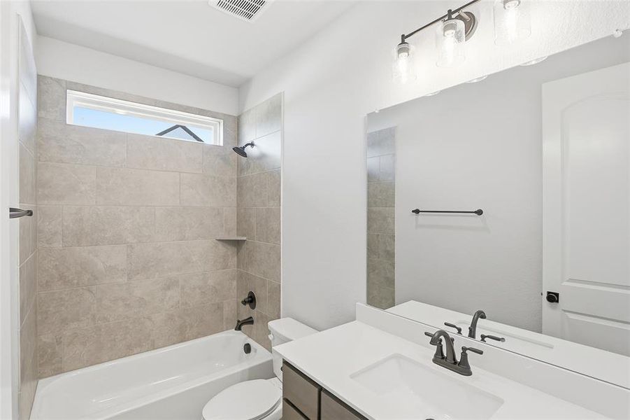 Bathroom with bathtub / shower combination and vanity