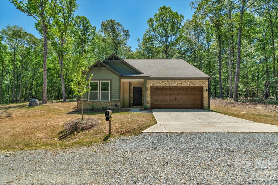 Front exterior of a new home in , Monroe, NC, highlighting curb appeal (Image 21).