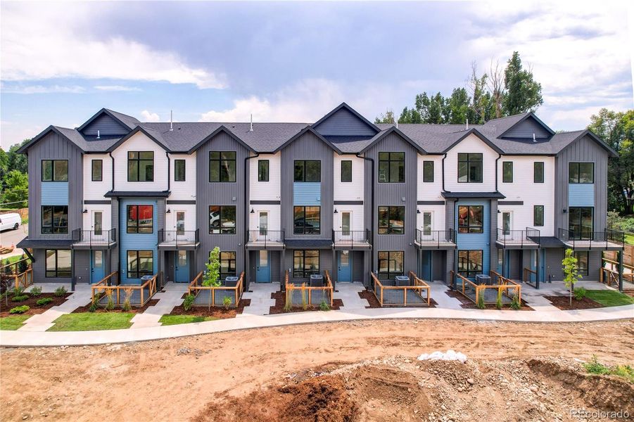 Front exterior of a new home in , Arvada, CO, highlighting curb appeal (Image 1).
