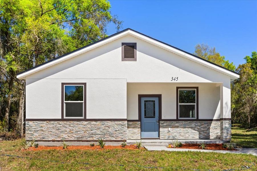 Front exterior of a new home in , Deland, FL, highlighting curb appeal (Image 1). Front exterior of a new home in , Deland, FL, highlighting curb appeal (Image 1).
