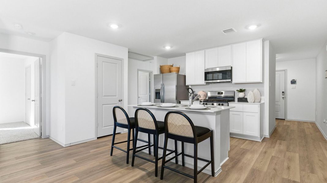 Representative furnished interior of a home built from the Estero by D.R. Horton in Watermark, Alvin (Image 5).