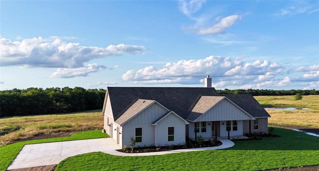 Front exterior of a new home in , Lone Oak, TX, highlighting curb appeal (Image 2). Front exterior of a new home in , Lone Oak, TX, highlighting curb appeal (Image 2).