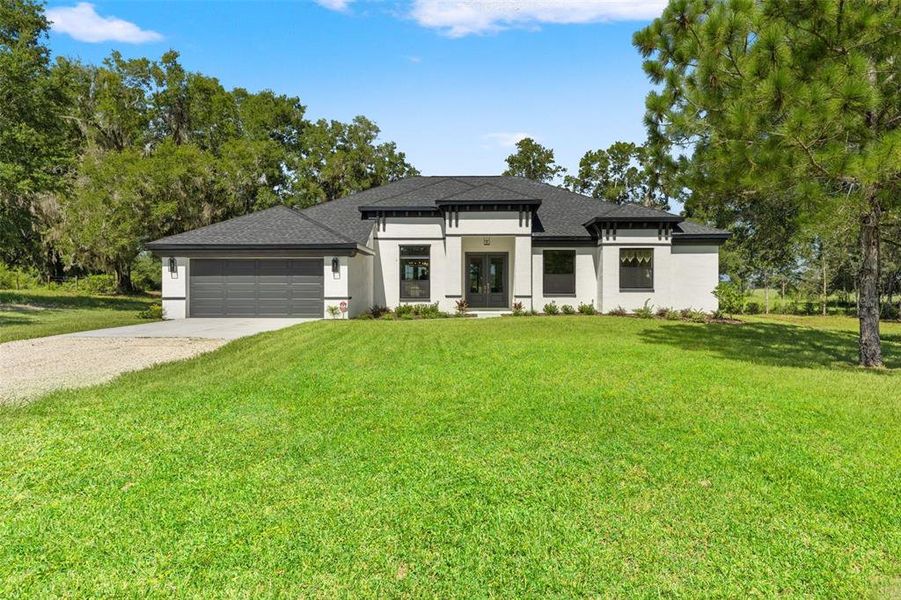 Front exterior of a new home in , Lecanto, FL, highlighting curb appeal (Image 26).