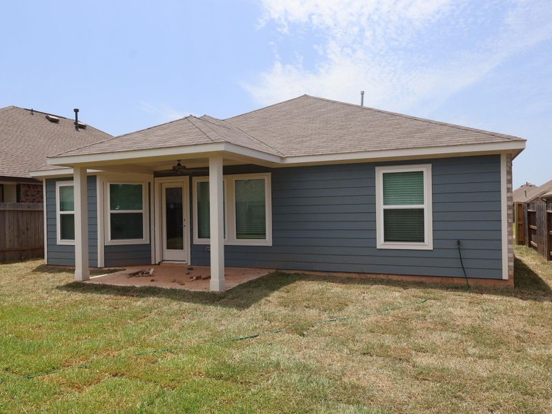 Exterior details and patio area of a home in Magnolia Ridge, Magnolia (Image 23).