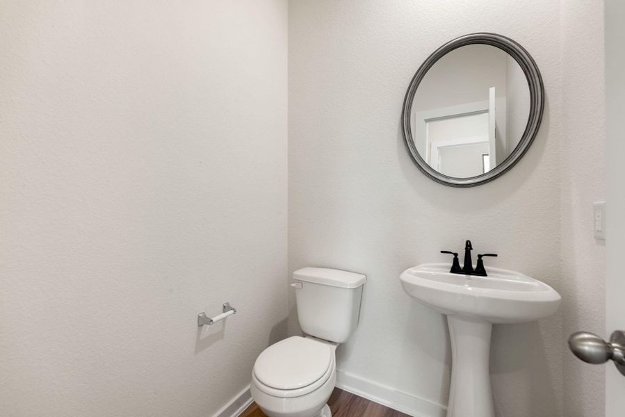 The main level features a convenient and stylish powder room, an essential addition for guests and everyday living. The main level features a convenient and stylish powder room, an essential addition for guests and everyday living.