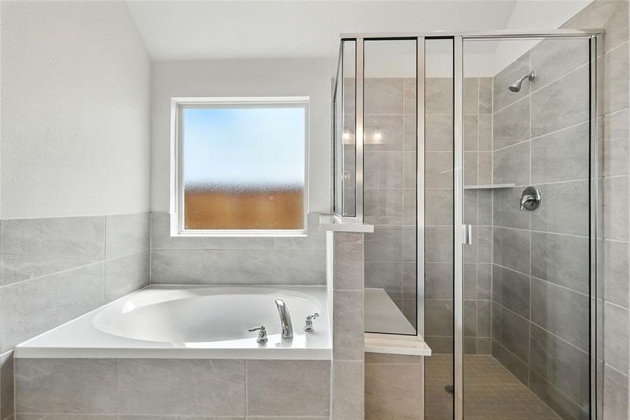 Full bath with a garden tub and a stall shower Full bath with a garden tub and a stall shower