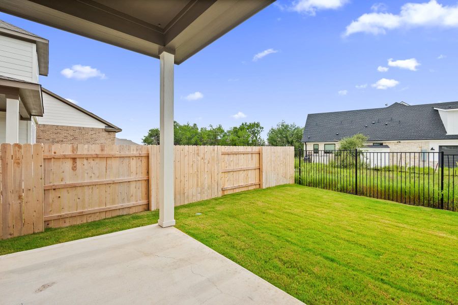 Exterior details and patio area of a home in Lariat, Liberty Hill (Image 4).