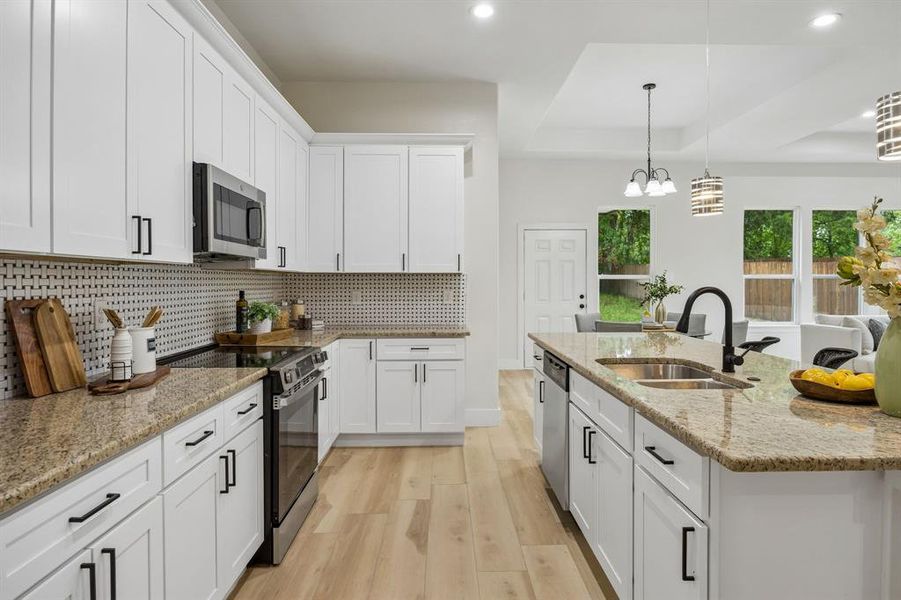 Appliances including a smooth top electric range, built in microwave and dishwasher.