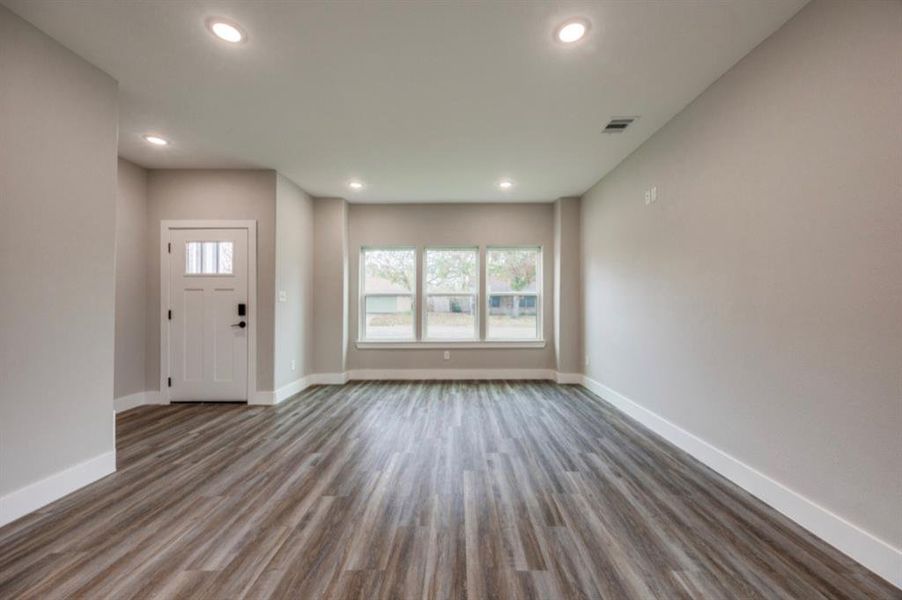 Entrance foyer featuring wood finished floors and recessed lighting
