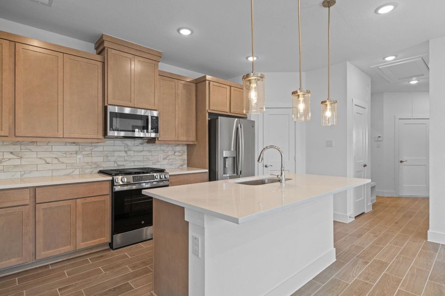 Furnished interior view inside a new home in Meridiana, Iowa Colony (Image 5).