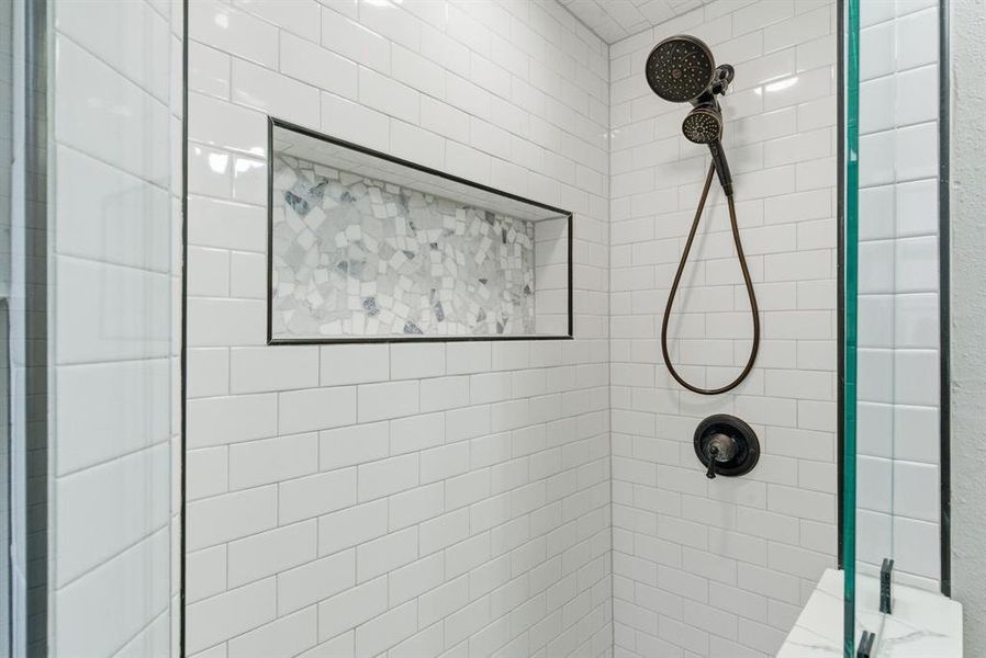 Full bath featuring tiled shower Full bath featuring tiled shower