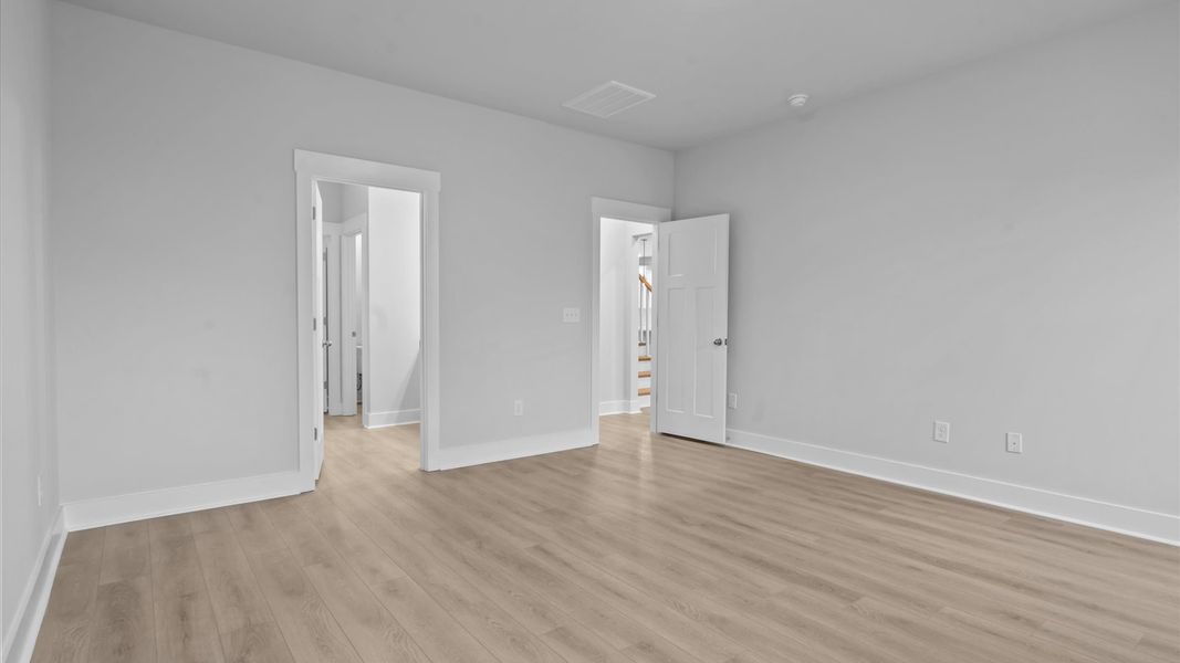 Eye-catching details and elegant finishes in the vibrant primary suite of this select home Eye-catching details and elegant finishes in the vibrant primary suite of this select home