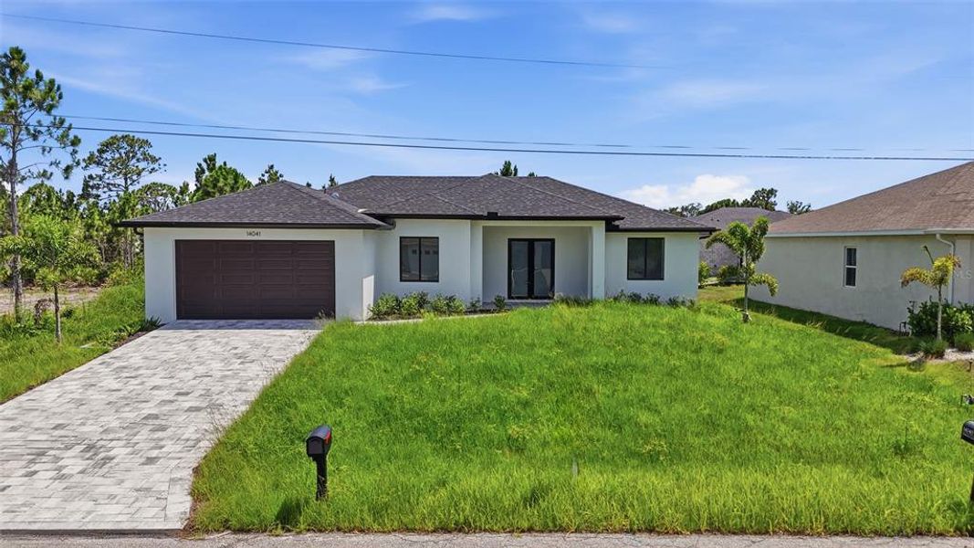 Front exterior of a new home in , Port Charlotte, FL, highlighting curb appeal (Image 17). Front exterior of a new home in , Port Charlotte, FL, highlighting curb appeal (Image 17).