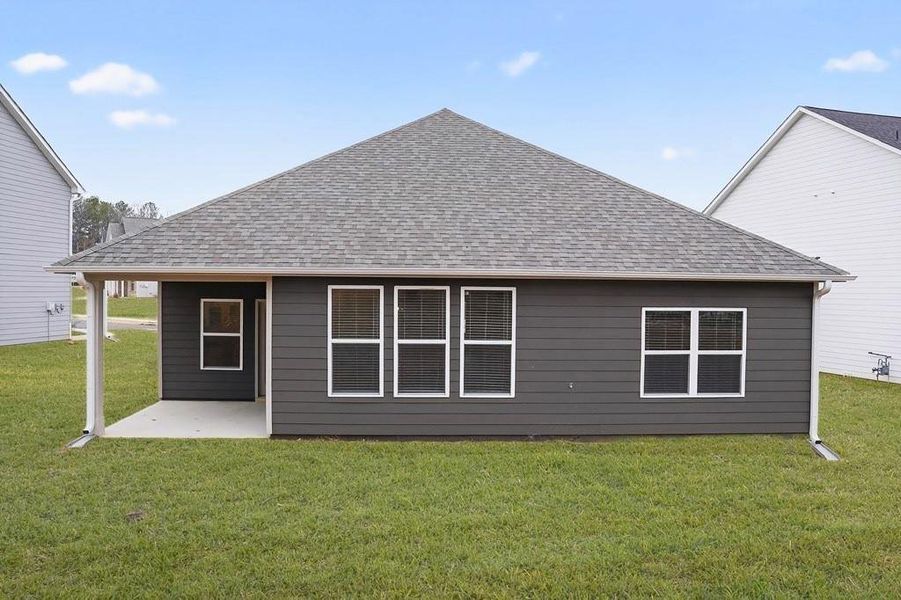 Exterior details and patio area of a home in The Fairways at Mirror Lake, Villa Rica (Image 27).