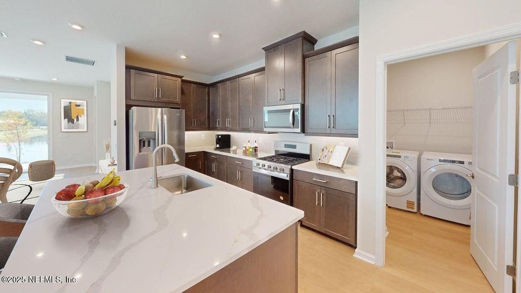 Furnished interior view inside a new home in RiverTown - WaterSong, St. Johns (Image 5).