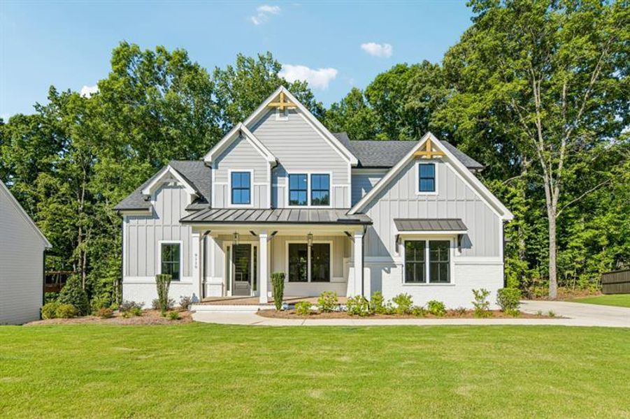 Front exterior of a new home in White Post on Lake Lanier, Gainesville, GA, highlighting curb appeal (Image 1). Front exterior of a new home in White Post on Lake Lanier, Gainesville, GA, highlighting curb appeal (Image 1).