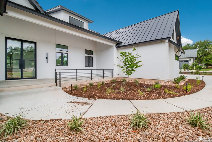 Front exterior of a new home in , Spring Branch, TX, highlighting curb appeal (Image 16). Front exterior of a new home in , Spring Branch, TX, highlighting curb appeal (Image 16).