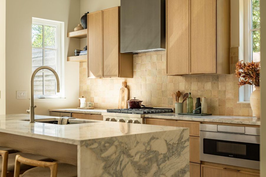 Fine wood cabinetry and natural stone countertops anchor this carefully designed workspace. Fine wood cabinetry and natural stone countertops anchor this carefully designed workspace.