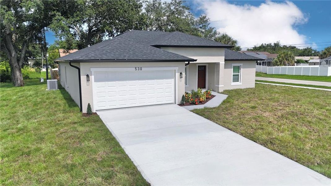 Front exterior of a new home in , Port Charlotte, FL, highlighting curb appeal (Image 25).