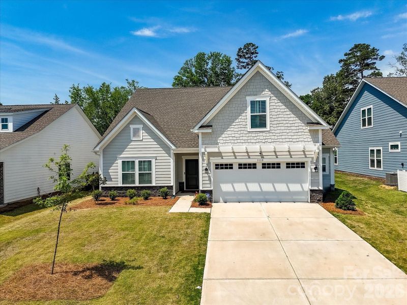 Front exterior of a new home in , Monroe, NC, highlighting curb appeal (Image 24).