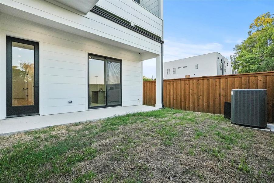 View of yard with a patio area and central air condition unit