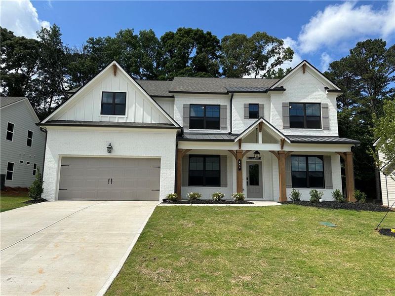 Front exterior of a new home in Rosewood Lake Estates, Hoschton, GA, highlighting curb appeal (Image 21).