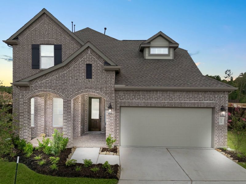 Front exterior of a new home in The Trails, New Caney, TX, highlighting curb appeal (Image 22).