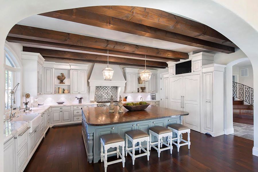Example of Builder finish out. exhaust hood, open shelves, and white cabinetry Example of Builder finish out. exhaust hood, open shelves, and white cabinetry