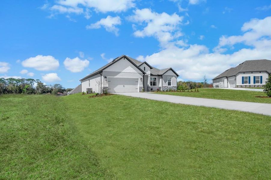 Front exterior of a new home in , Fruitland Park, FL, highlighting curb appeal (Image 1). Front exterior of a new home in , Fruitland Park, FL, highlighting curb appeal (Image 1).